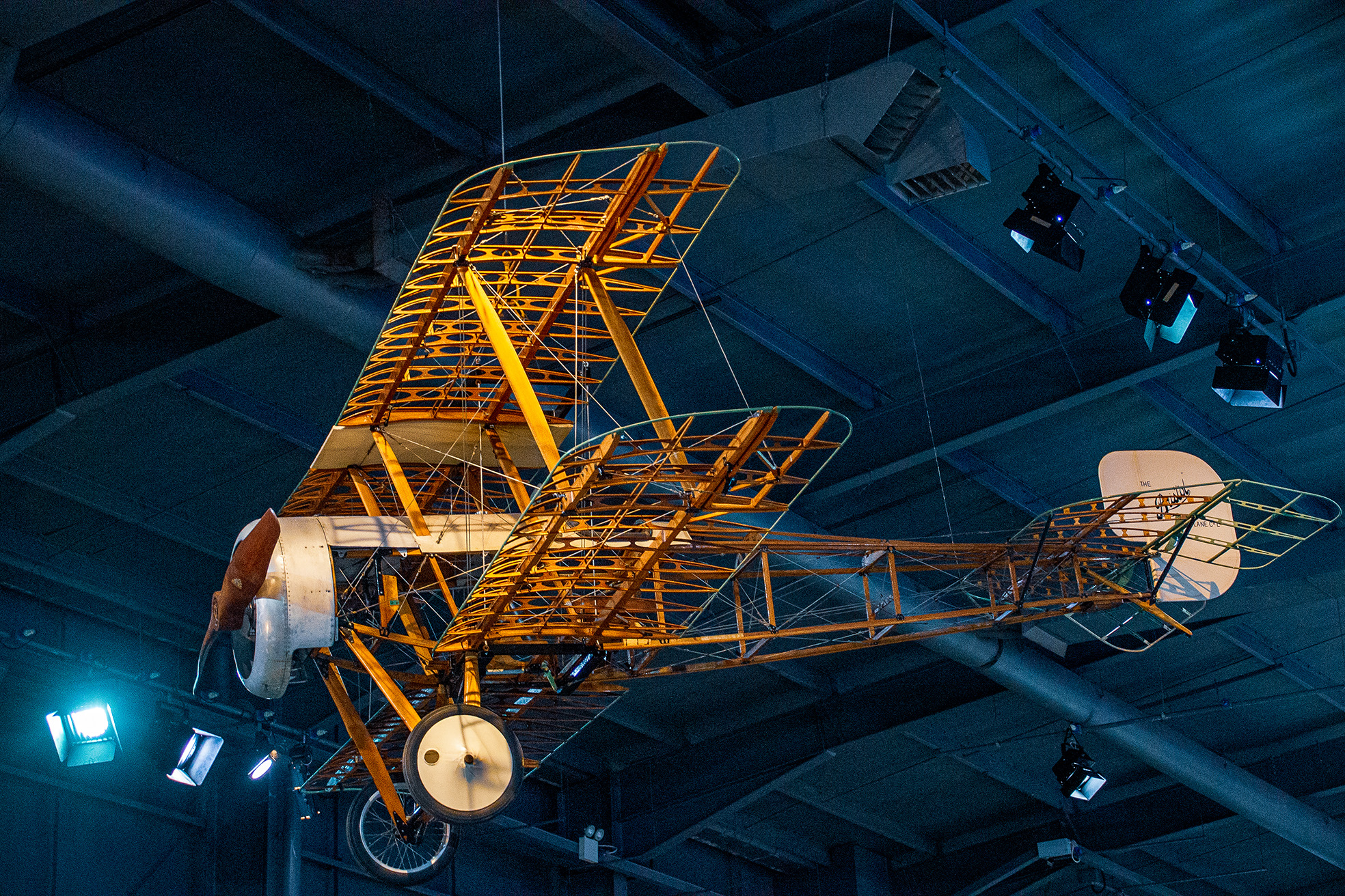 The image depicts an early model of an airplane, likely from the pioneering era of aviation.
