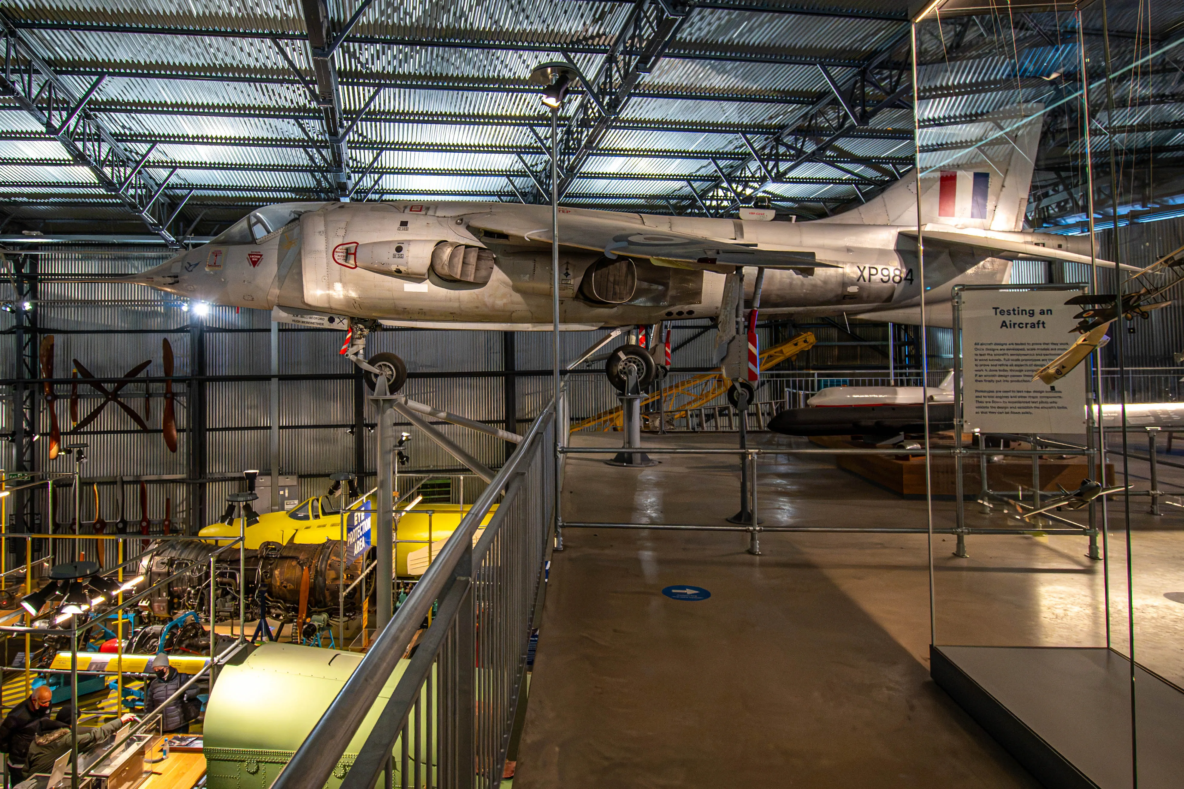 Harrier prototype XP984 suspended in a museum hall above other aviation exhibits.