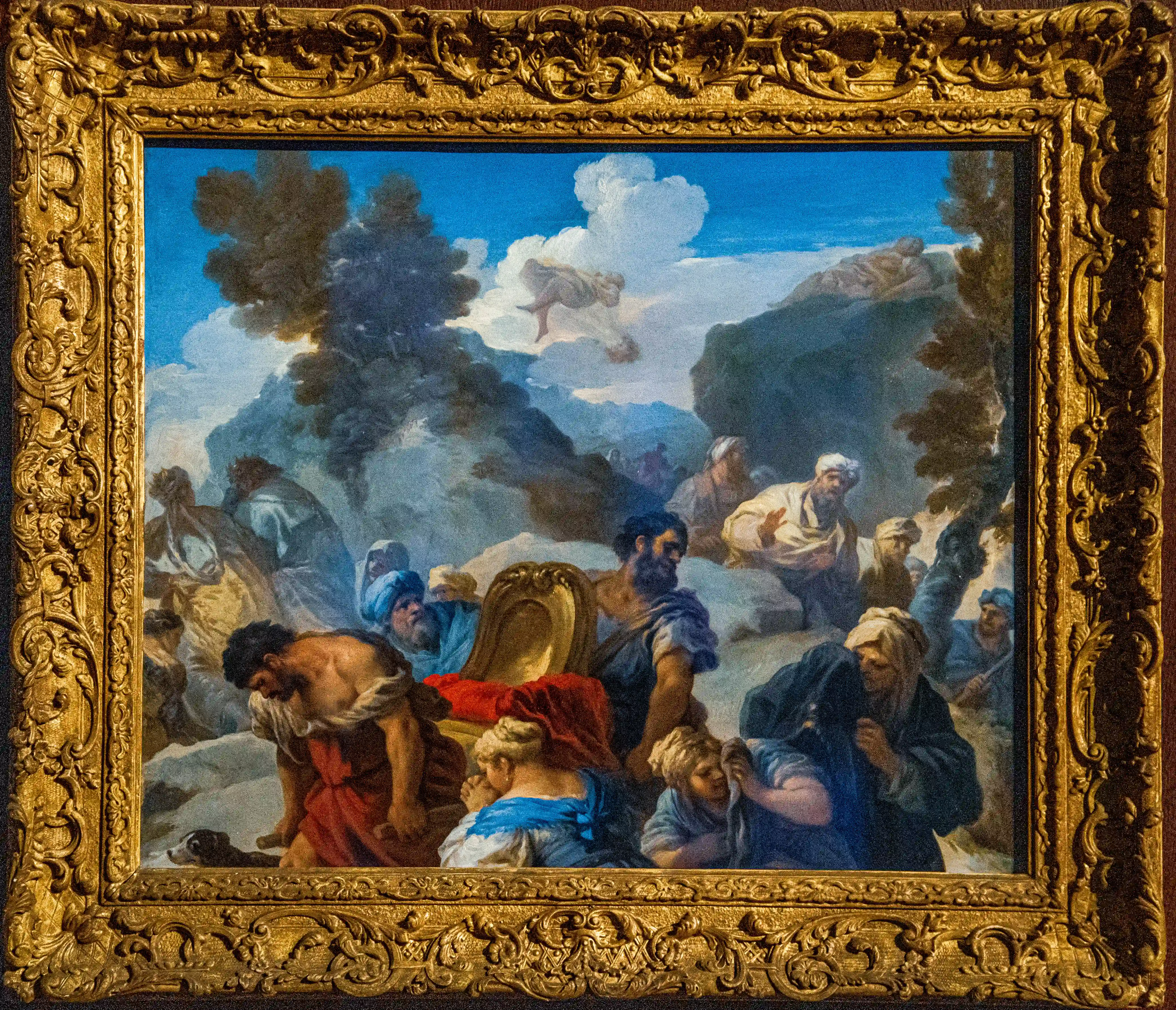 Classical painting in an ornate gold frame showing multiple figures in a dramatic outdoor scene.