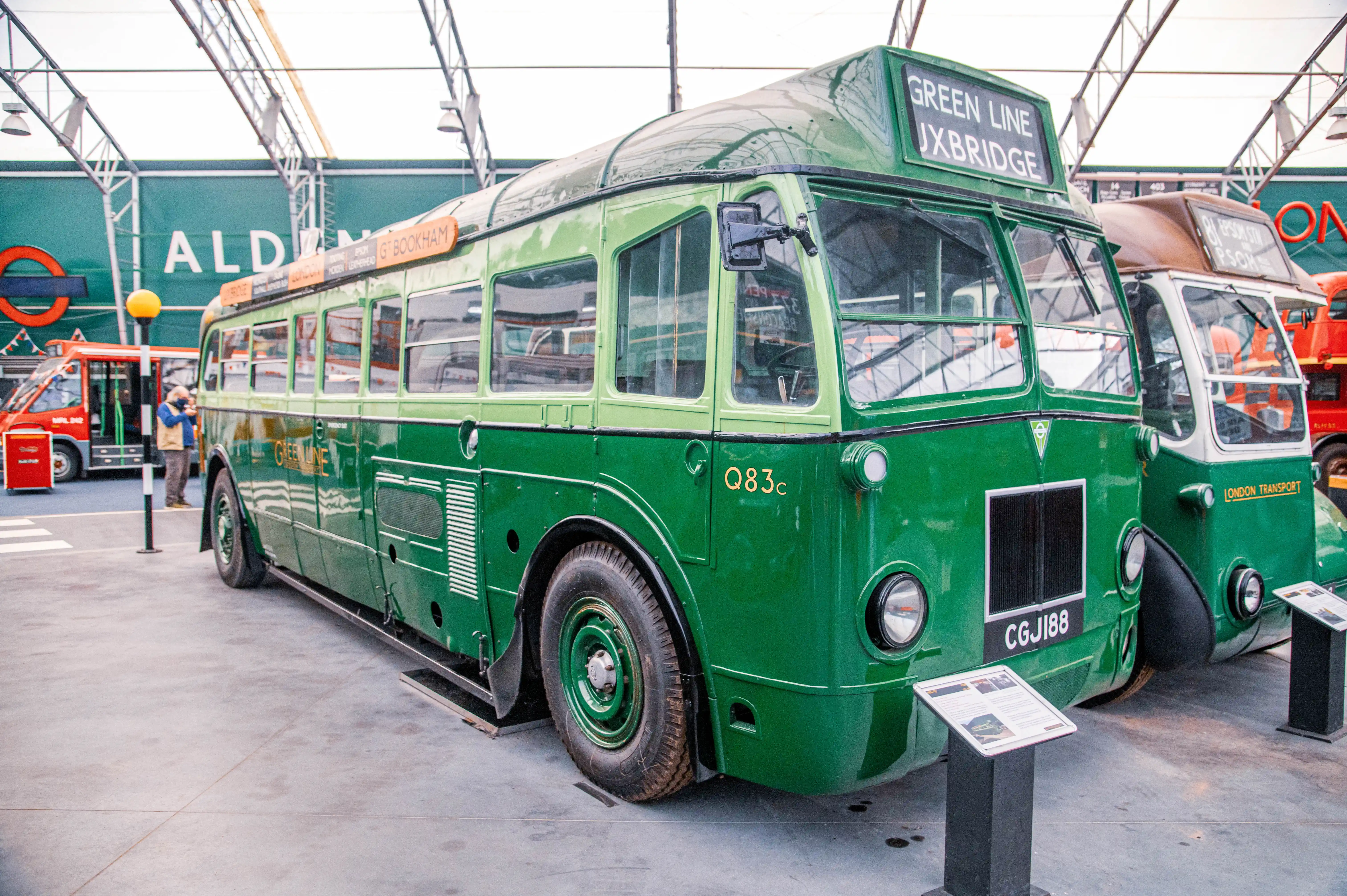 Side view of a vintage green Green Line bus, with Uxbridge displayed on the front.