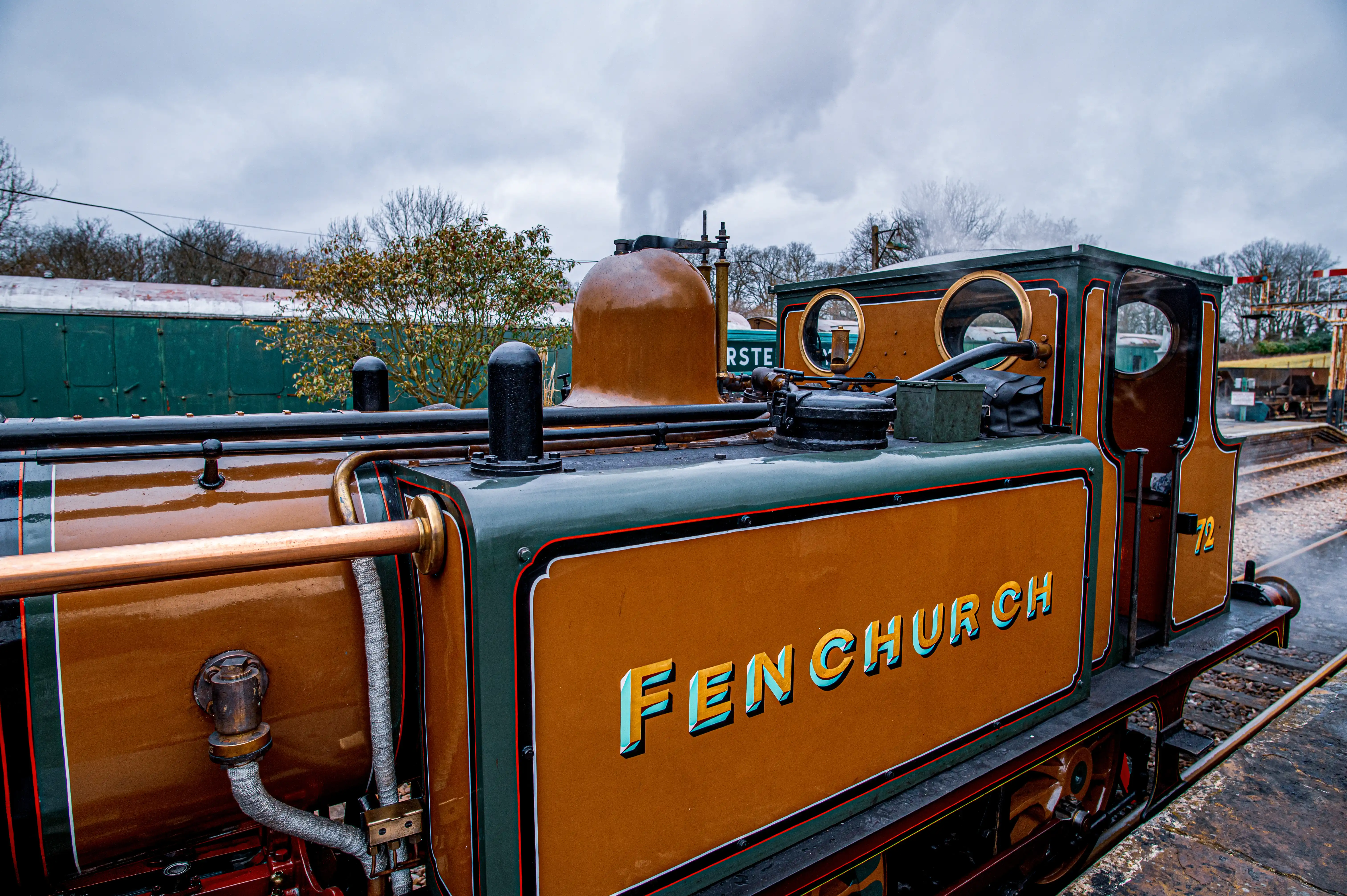 A close-up side view of a vintage steam locomotive named 