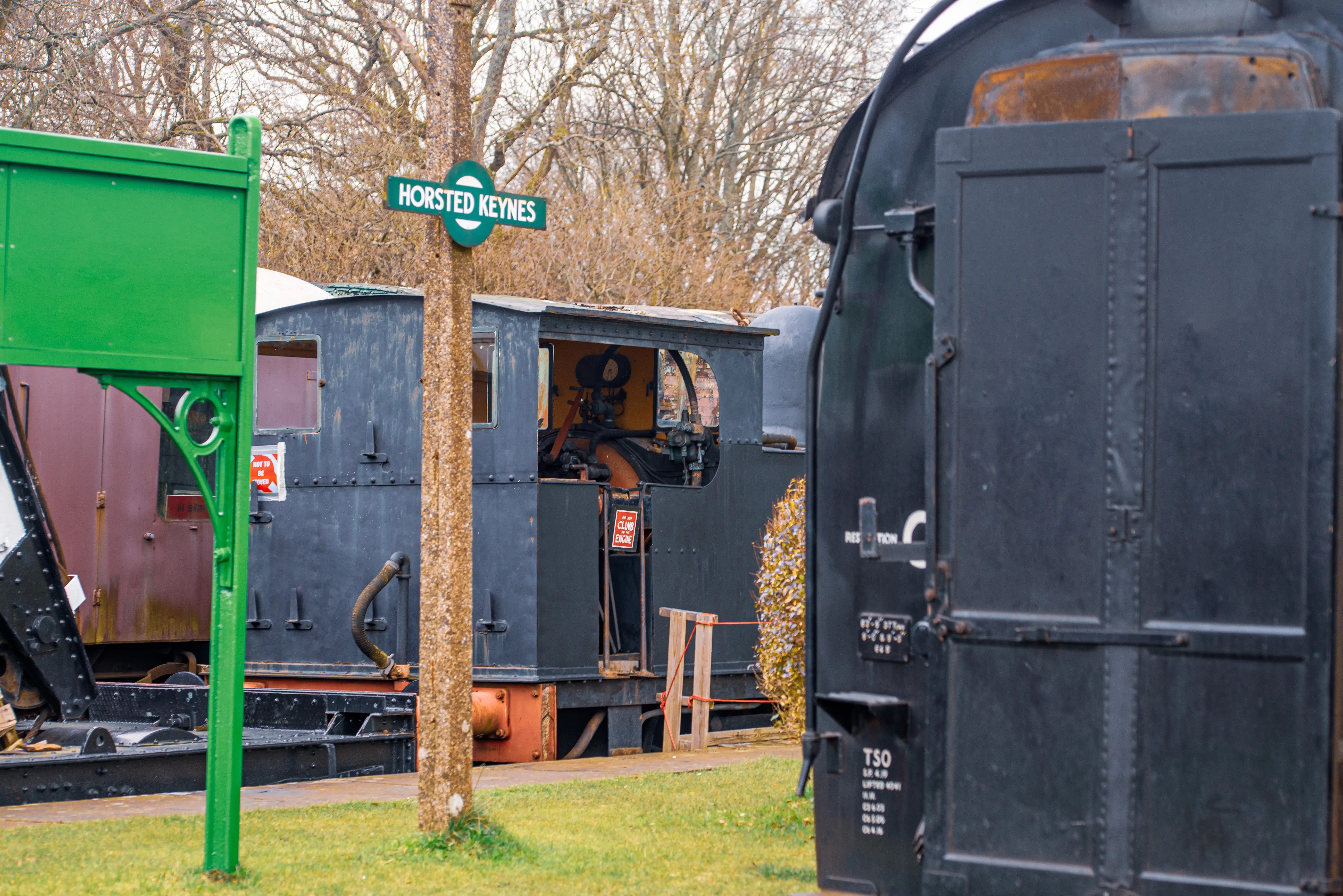 A steam train engine with an open cab and a 