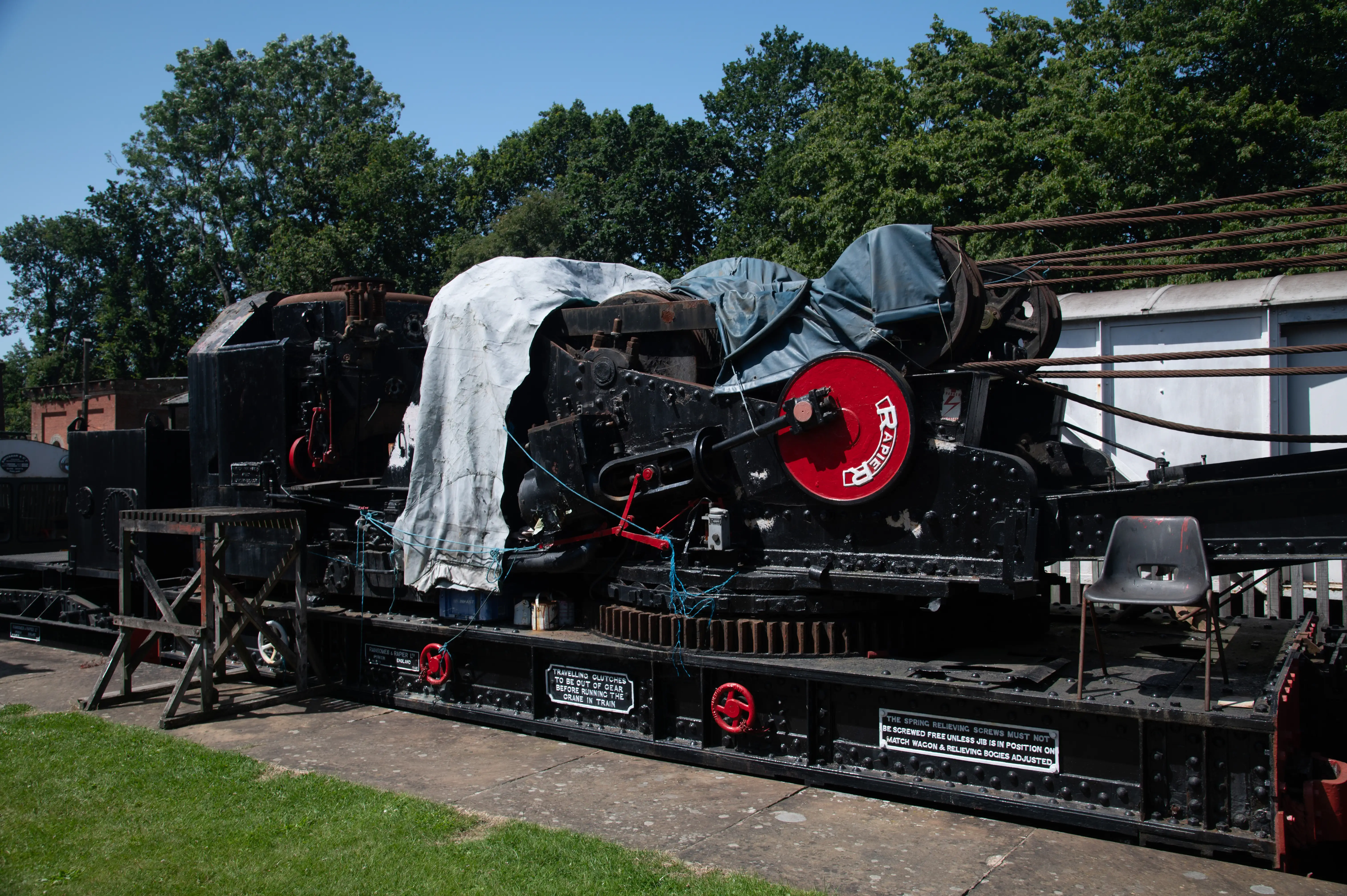 A section of a large, black, industrial crane mechanism, labelled 