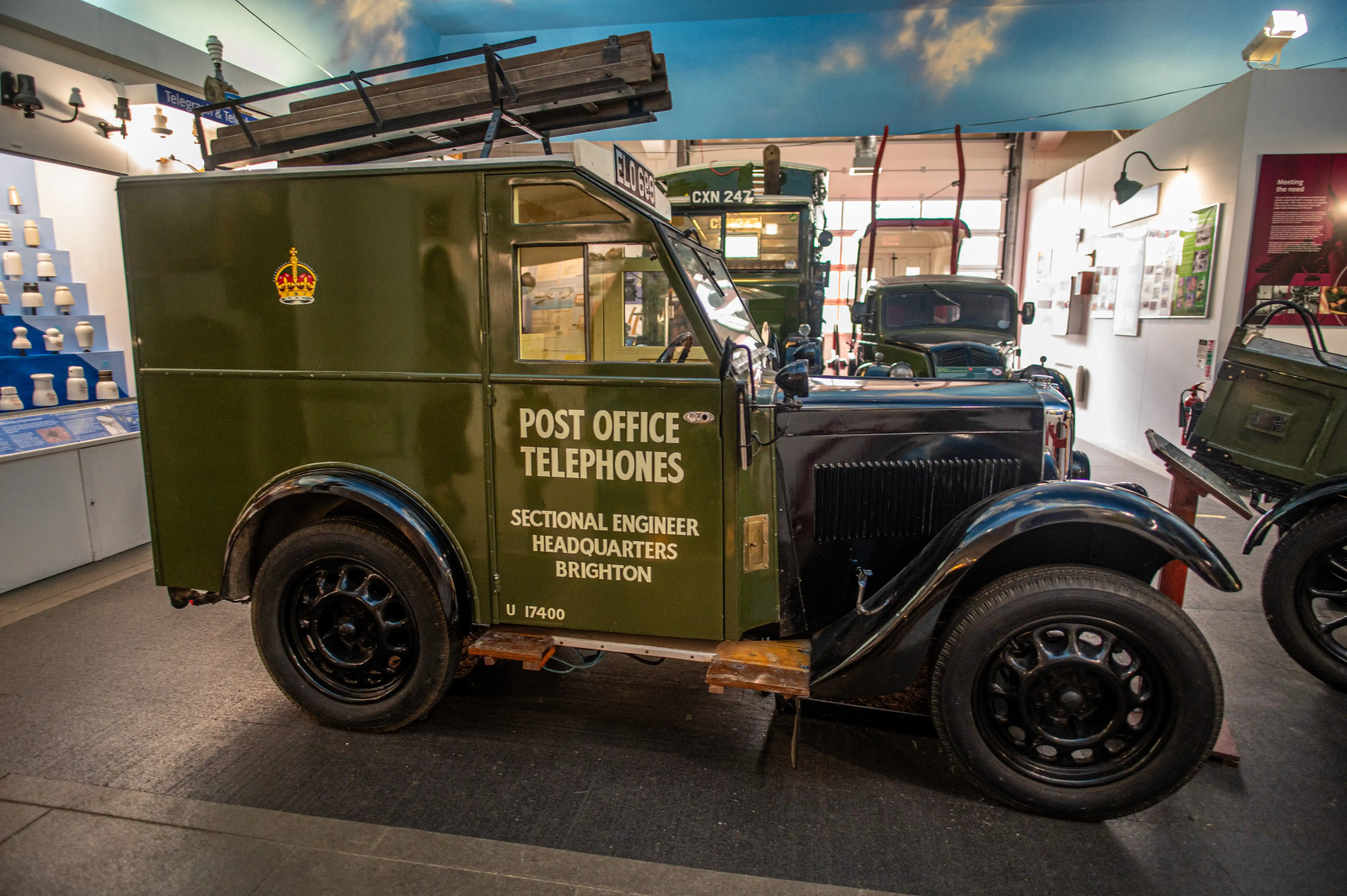 Side view of a vintage green Post Office Telephones van with the lettering &laquo;SECTIONAL ENGINEER HEADQUARTERS BRIGHTON&raquo